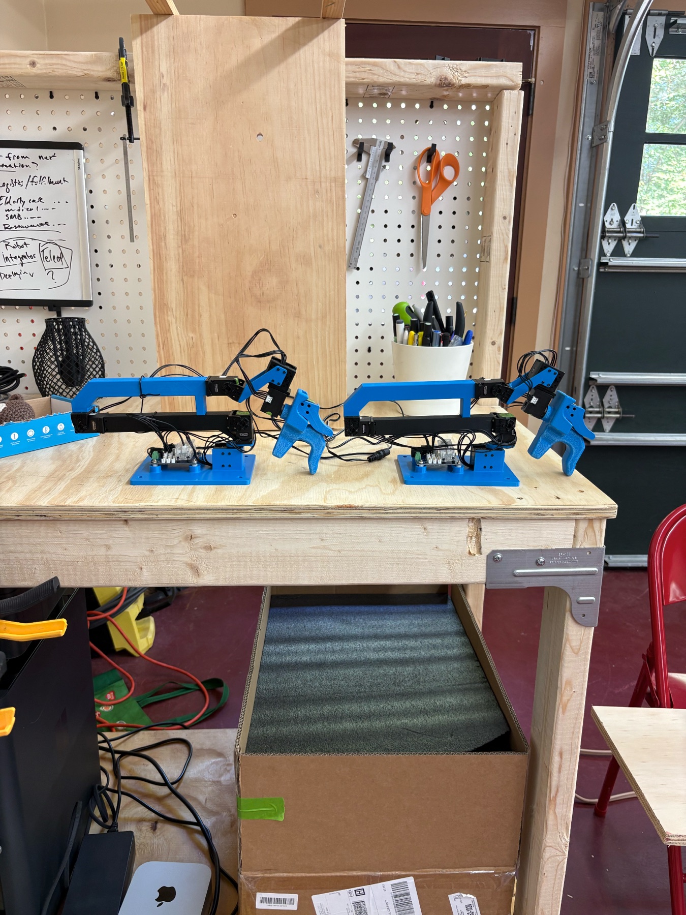 Two assembled blue GELLO leader arms