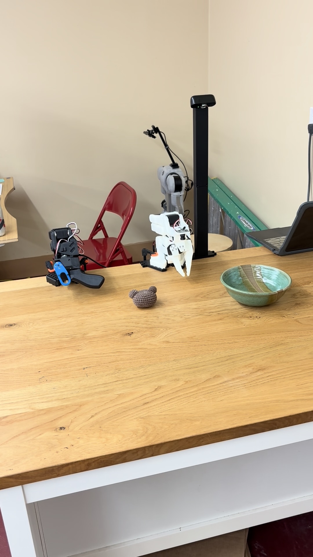 SO-101 leader and follower arms, test object, bowl, and overhead camera